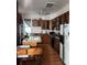 Functional kitchen with wooden cabinets, laminate countertops, and a vintage-style refrigerator at 425 W Horah St, Salisbury, NC 28144
