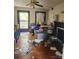 A cluttered living room featuring hardwood floors, large windows, and a fireplace at 425 W Horah St, Salisbury, NC 28144