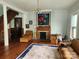 Cozy living room with hardwood floors and an ornate fireplace with mantle at 425 W Horah St, Salisbury, NC 28144