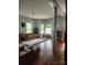 Spacious living room featuring hardwood floors, large windows, and a vintage-style chandelier at 425 W Horah St, Salisbury, NC 28144