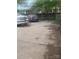 Backyard view with a parking area, surrounded by fence and some foliage at 425 W Horah St, Salisbury, NC 28144