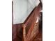 Classic wooden staircase with detailed spindles and paneled walls at 425 W Horah St, Salisbury, NC 28144