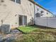 Fenced backyard with patio and green grass at 463 Delta Dr, Fort Mill, SC 29715