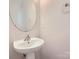 Bathroom features a pedestal sink with chrome faucet and light neutral colors at 463 Delta Dr, Fort Mill, SC 29715