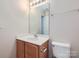 Bathroom featuring a wood vanity, a large mirror and bright lighting at 463 Delta Dr, Fort Mill, SC 29715