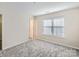 Bedroom featuring plush carpet, neutral colors and natural light from the window at 463 Delta Dr, Fort Mill, SC 29715