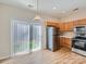 Bright dining area featuring a sliding glass door to the backyard and stainless steel appliances at 463 Delta Dr, Fort Mill, SC 29715