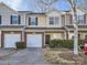 Charming townhouse with a one car garage, brick accents, and a well maintained lawn at 463 Delta Dr, Fort Mill, SC 29715