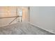 Upstairs hallway featuring neutral colored carpet and white trim at 463 Delta Dr, Fort Mill, SC 29715