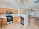 Open kitchen featuring stainless steel appliances, bright lighting and wood cabinets at 463 Delta Dr, Fort Mill, SC 29715