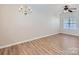 Bright living room with hardwood floors, neutral paint, large window, and a ceiling fan at 463 Delta Dr, Fort Mill, SC 29715