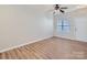 Bright living room with hardwood floors, neutral paint, large window, and a ceiling fan at 463 Delta Dr, Fort Mill, SC 29715