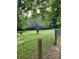 Scenic backyard with a beautiful tree and wooden fence, offering a serene outdoor space at 490 S Moose Rd, Mount Pleasant, NC 28124