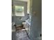 Bathroom featuring white cabinets, vinyl flooring and a single vanity sink offering practical functionality at 490 S Moose Rd, Mount Pleasant, NC 28124