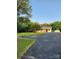 Quaint home with mature trees, a spacious driveway and a charming exterior at 490 S Moose Rd, Mount Pleasant, NC 28124