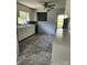 Functional kitchen with white cabinets and countertops, a black dishwasher, and a double basin sink at 490 S Moose Rd, Mount Pleasant, NC 28124
