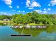 Stunning aerial view of private boat docks nestled on the lake, showcasing waterfront living at 49009 Dockside Ln # D, Albemarle, NC 28001