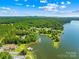 Captivating aerial view showcasing waterfront homes and docks along the lake, offering stunning vistas at 49009 Dockside Ln # D, Albemarle, NC 28001