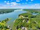 Breathtaking aerial view of the lake and waterfront property, surrounded by lush greenery and docks at 49009 Dockside Ln # D, Albemarle, NC 28001