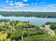 Aerial view featuring waterfront homes with private docks on a scenic lake, ideal for boating and recreation at 49009 Dockside Ln # D, Albemarle, NC 28001