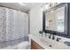 Charming bathroom with tiled shower, decorative mirror, and sleek fixtures at 49009 Dockside Ln # D, Albemarle, NC 28001