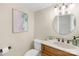 Cozy half-bathroom featuring wood-look vanity, decorative mirror and hardware at 49009 Dockside Ln # D, Albemarle, NC 28001