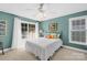 Bright bedroom with slider door, plush carpet and cooling ceiling fan at 49009 Dockside Ln # D, Albemarle, NC 28001