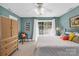 Comfortable bedroom with a slider door to the outside and stylish wicker furniture at 49009 Dockside Ln # D, Albemarle, NC 28001