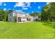Spacious home featuring a lush green lawn and multiple balconies, perfect for outdoor relaxation at 49009 Dockside Ln # D, Albemarle, NC 28001