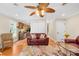 Inviting living room with hardwood floors, ceiling fan, and view of the kitchen at 49009 Dockside Ln # D, Albemarle, NC 28001