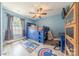 Bright bedroom with a playful baseball theme, complemented by a modern ceiling fan and natural light from the window at 516 Fair Oaks Dr, Fort Mill, SC 29708