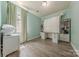 Bedroom with built-in desk, shelving, and mint green walls at 516 Fair Oaks Dr, Fort Mill, SC 29708
