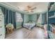Bedroom featuring wood-look flooring, large windows, and comfortable furniture at 516 Fair Oaks Dr, Fort Mill, SC 29708