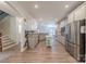 Open-concept kitchen featuring stainless steel appliances, a center island, and white cabinets at 516 Fair Oaks Dr, Fort Mill, SC 29708