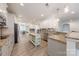 Spacious kitchen with stainless steel appliances, a central island and wood-style flooring at 516 Fair Oaks Dr, Fort Mill, SC 29708