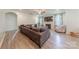 Living room features a large sofa, fireplace, tv and light wood-style flooring at 516 Fair Oaks Dr, Fort Mill, SC 29708