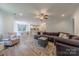 Inviting living room featuring a cozy couch, patterned rug, and seamless flow into the kitchen at 516 Fair Oaks Dr, Fort Mill, SC 29708