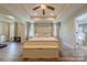 Spacious main bedroom with trey ceiling, fan, and access to an ensuite bathroom at 516 Fair Oaks Dr, Fort Mill, SC 29708