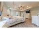 Comfortable main bedroom with trey ceiling, fan, and access to a walk-in closet at 516 Fair Oaks Dr, Fort Mill, SC 29708