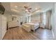 Spacious main bedroom featuring tray ceiling, ceiling fan, and a glimpse of an exercise area at 516 Fair Oaks Dr, Fort Mill, SC 29708