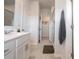 Bright bathroom featuring a glass enclosed shower and an adjacent vanity at 5440 Kinsbridge Dr, Charlotte, NC 28227