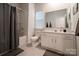 Bright bathroom with shower and tub combination, white vanity and tile flooring at 5440 Kinsbridge Dr, Charlotte, NC 28227
