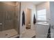 Bright bathroom with glass-enclosed shower and modern vanity at 5440 Kinsbridge Dr, Charlotte, NC 28227
