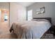 Neutral bedroom features soft carpet, a picture window and gray walls at 5440 Kinsbridge Dr, Charlotte, NC 28227