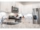 Modern kitchen featuring granite countertops, stainless steel appliances, and ample cabinet space at 5440 Kinsbridge Dr, Charlotte, NC 28227