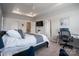Relaxing bedroom featuring a tray ceiling, and an adjacent workspace at 5440 Kinsbridge Dr, Charlotte, NC 28227