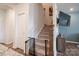 Carpeted staircase with a safety gate and modern design at 5440 Kinsbridge Dr, Charlotte, NC 28227