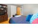 Comfortable bedroom with warm hardwood floors, featuring a queen bed and closet, ensuring ample storage at 6128 Coatbridge Ln, Charlotte, NC 28212