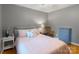 Comfortable bedroom with soft grey walls, complemented by a queen bed and side tables with lamps at 6128 Coatbridge Ln, Charlotte, NC 28212