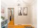 Inviting foyer with hardwood floors and neutral walls decorated with artwork at 6128 Coatbridge Ln, Charlotte, NC 28212
